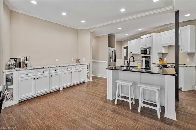 128 Provence Ct, King, NC 27021 - kitchen with stainless steel appliances, ornamental molding, recessed lighting, dark wood-style floors, and white cabinetry