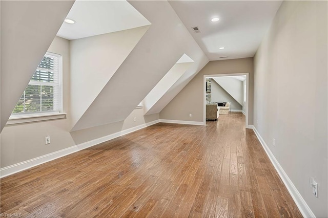 128 Provence Ct, King, NC 27021 - additional living space featuring hardwood / wood-style floors, vaulted ceiling, and recessed lighting