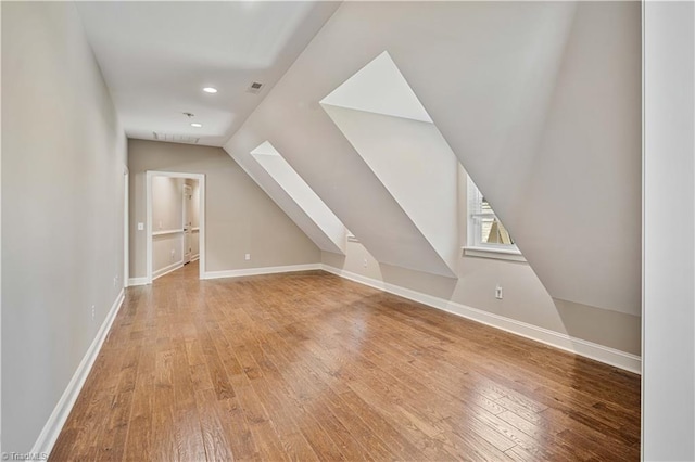 128 Provence Ct, King, NC 27021 - bonus room featuring wood-type flooring, lofted ceiling, a skylight, and recessed lighting
