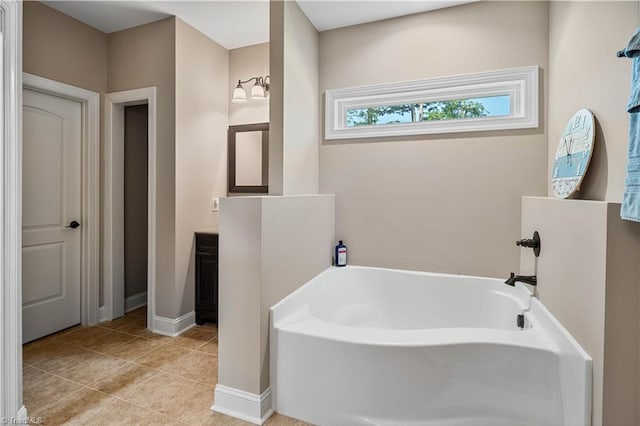 128 Provence Ct, King, NC 27021 - bathroom featuring a garden tub, vanity, and tile patterned floors