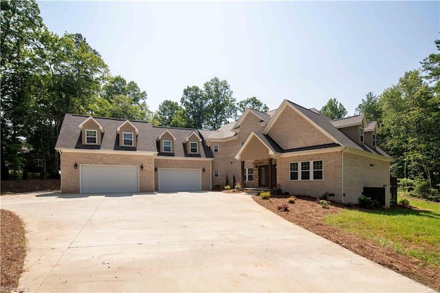 128 Provence Ct, King, NC 27021 - view of front of house featuring brick siding, driveway, an attached garage, and roof with shingles