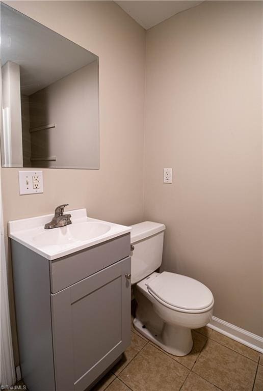 2370 W Clemmonsville Rd, Winston-Salem, NC 27127 - half bath with toilet, vanity, tile patterned floors, and baseboards