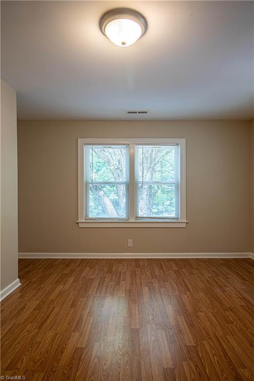 2370 W Clemmonsville Rd, Winston-Salem, NC 27127 - empty room featuring healthy amount of natural light, baseboards, and wood finished floors