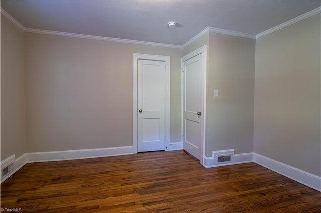 2370 W Clemmonsville Rd, Winston-Salem, NC 27127 - empty room featuring dark wood-style floors, baseboards, ornamental molding, and a smoke detector