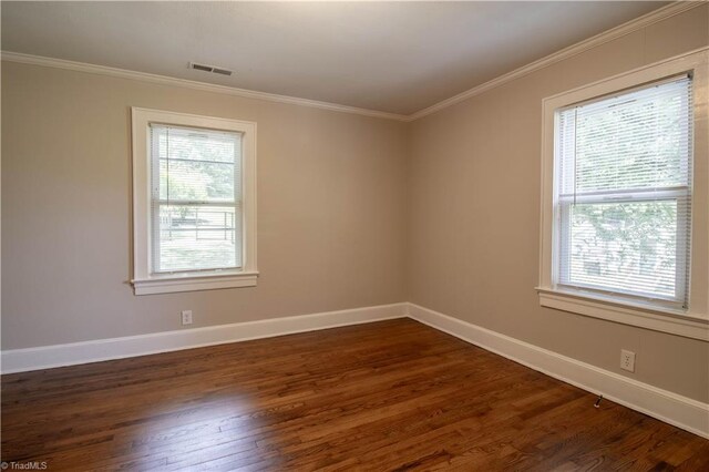 2370 W Clemmonsville Rd, Winston-Salem, NC 27127 - spare room featuring dark wood-style floors, baseboards, and crown molding