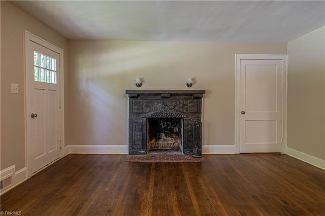 2370 W Clemmonsville Rd, Winston-Salem, NC 27127 - unfurnished living room featuring wood finished floors, baseboards, and a fireplace