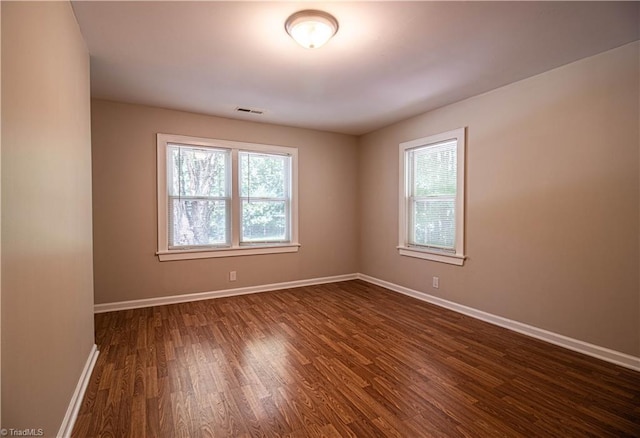 2370 W Clemmonsville Rd, Winston-Salem, NC 27127 - spare room with dark wood-style flooring and baseboards