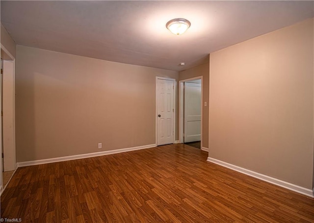 2370 W Clemmonsville Rd, Winston-Salem, NC 27127 - empty room with dark wood finished floors and baseboards