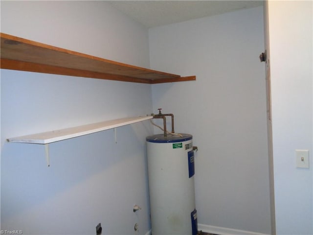 laundry area with water heater