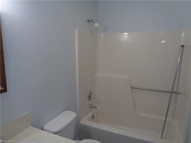 bathroom with toilet and washtub / shower combination