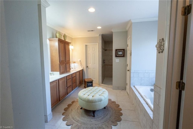 full bathroom with tile patterned flooring, a shower stall, double vanity, ornamental molding, and a bath