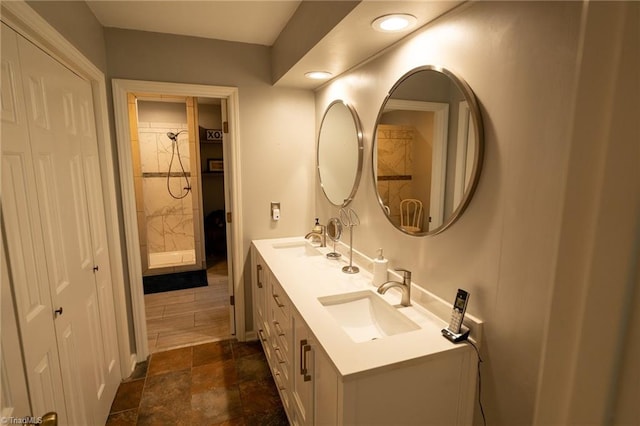 bathroom with double vanity, recessed lighting, and a sink