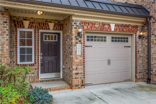 doorway to property featuring a garage