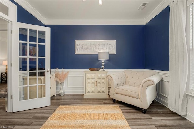 1348 Motsinger Rd, Winston-Salem, NC 27107 - sitting room with crown molding, visible vents, wainscoting, a decorative wall, and wood finished floors