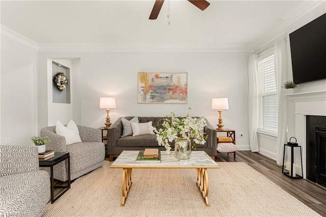 1348 Motsinger Rd, Winston-Salem, NC 27107 - living room with ornamental molding, a ceiling fan, wood finished floors, and a fireplace