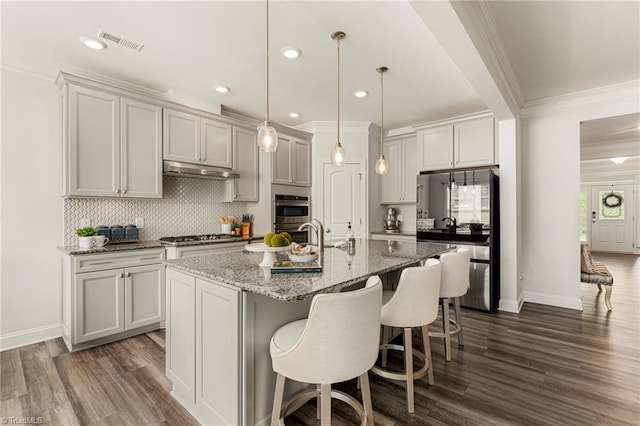 1348 Motsinger Rd, Winston-Salem, NC 27107 - kitchen with ornamental molding, stainless steel appliances, tasteful backsplash, visible vents, and dark wood-style floors