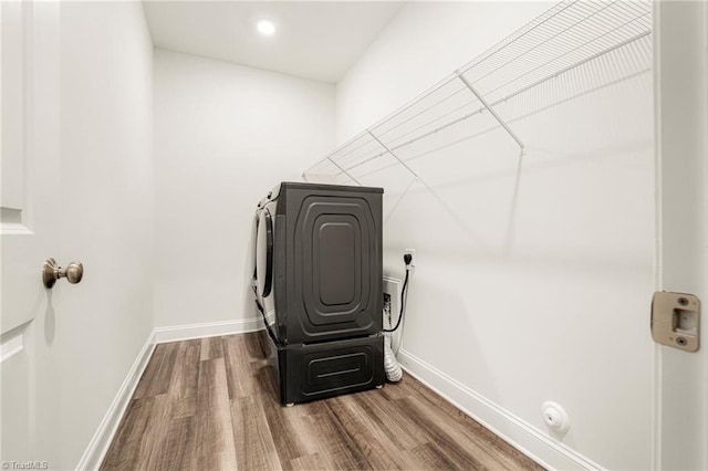 1348 Motsinger Rd, Winston-Salem, NC 27107 - laundry room with laundry area, recessed lighting, baseboards, wood finished floors, and washer and clothes dryer
