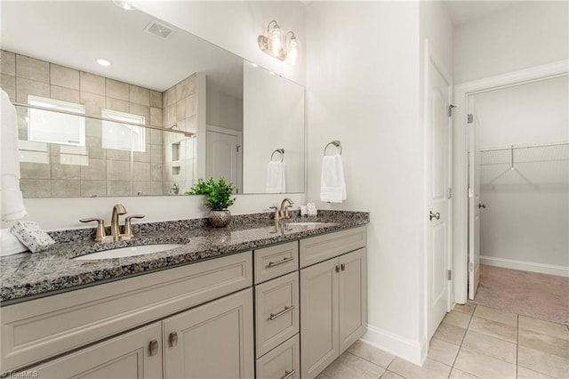 1348 Motsinger Rd, Winston-Salem, NC 27107 - bathroom featuring a sink, tile patterned floors, a stall shower, and double vanity