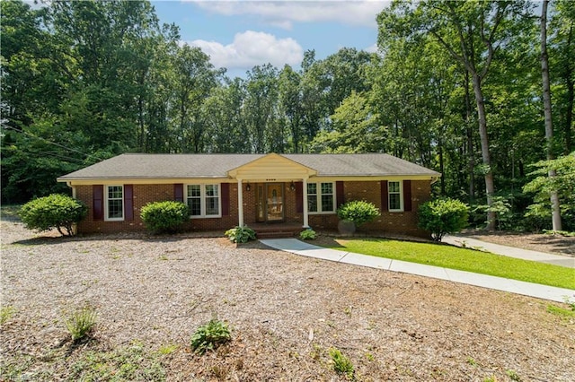 3306 Midkiff Rd, Winston-Salem, NC 27106 - ranch-style home with brick siding and gravel driveway
