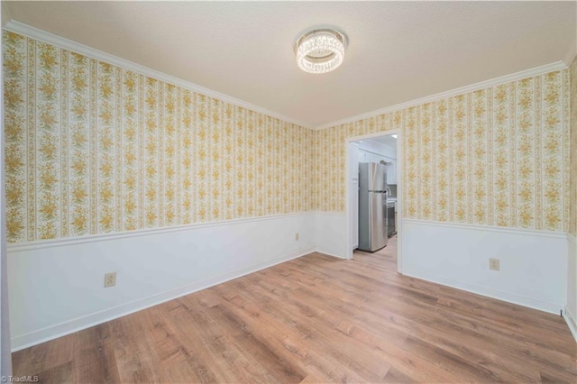 3306 Midkiff Rd, Winston-Salem, NC 27106 - empty room with crown molding, a wainscoted wall, wood finished floors, a chandelier, and wallpapered walls