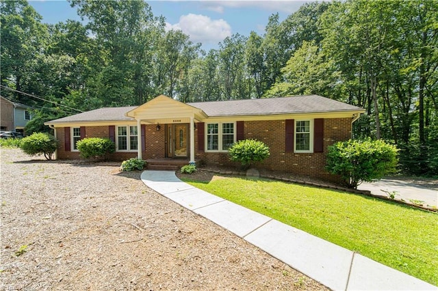 3306 Midkiff Rd, Winston-Salem, NC 27106 - ranch-style house with brick siding and a front lawn