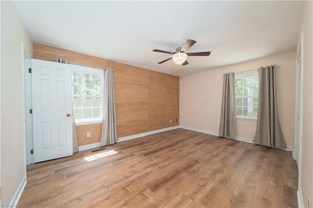 3306 Midkiff Rd, Winston-Salem, NC 27106 - empty room featuring baseboards, ceiling fan, and healthy amount of natural light