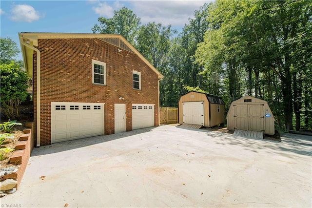 3306 Midkiff Rd, Winston-Salem, NC 27106 - view of property exterior with brick siding and a detached garage
