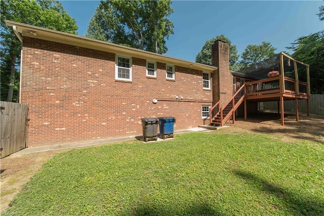 3306 Midkiff Rd, Winston-Salem, NC 27106 - rear view of house with stairs, a chimney, a wooden deck, and brick siding