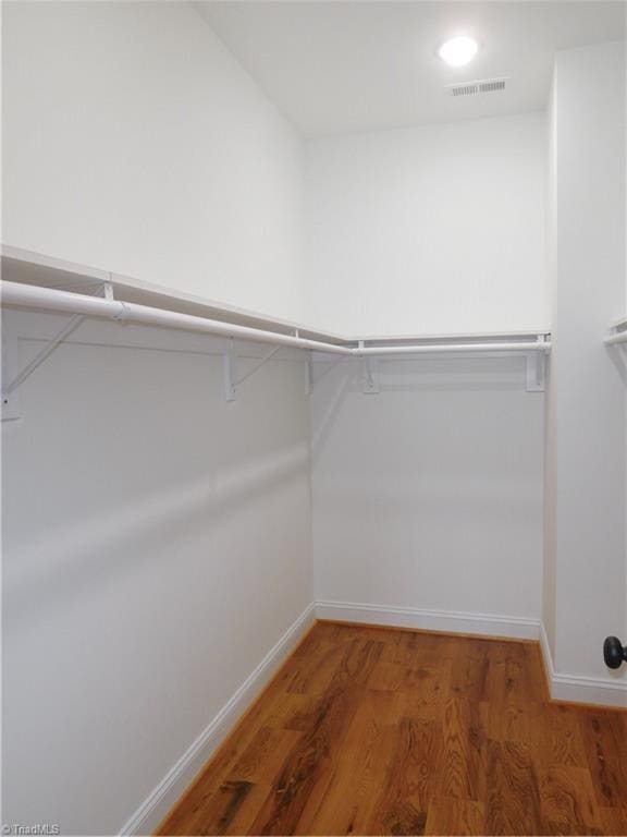 walk in closet featuring light wood-style flooring