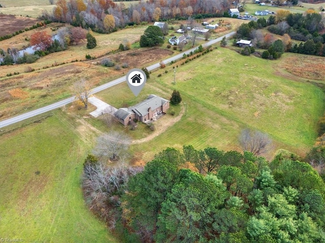 birds eye view of property featuring a rural view