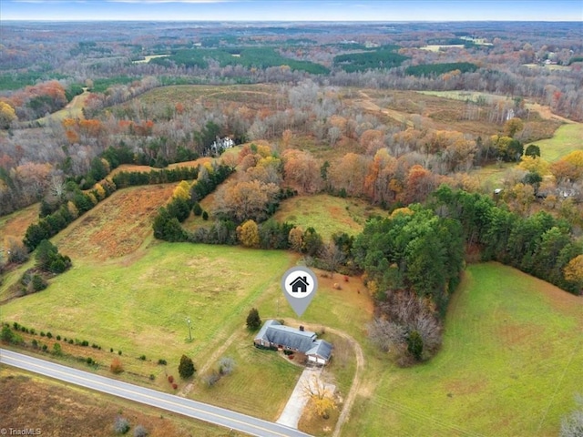 birds eye view of property with a rural view