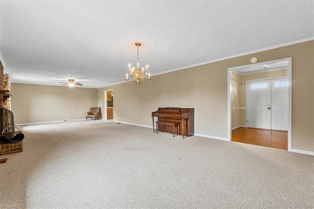 unfurnished living room with a textured ceiling, ornamental molding, light carpet, and a brick fireplace