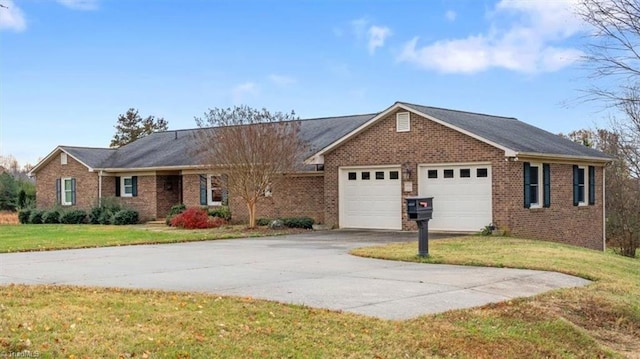 single story home with a front yard and a garage