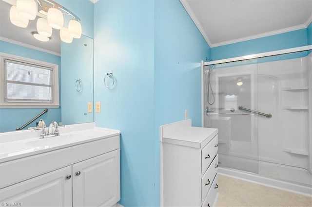 bathroom featuring ornamental molding, vanity, and a shower with shower door