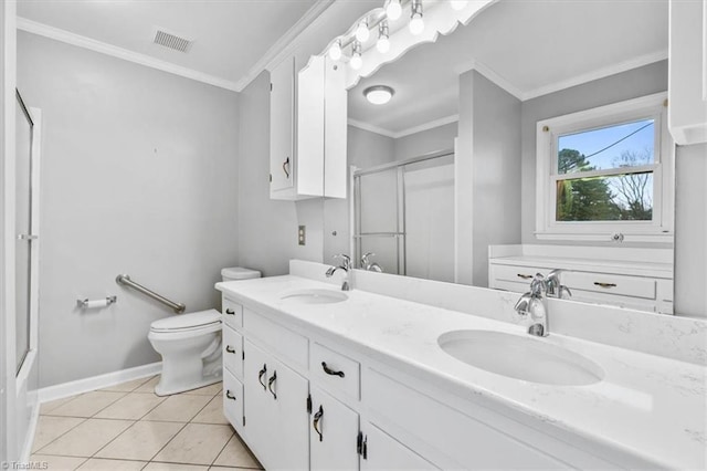 bathroom featuring tile patterned flooring, toilet, vanity, a shower with shower door, and ornamental molding