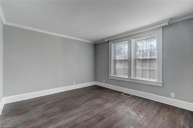 unfurnished room featuring ornamental molding and hardwood / wood-style flooring