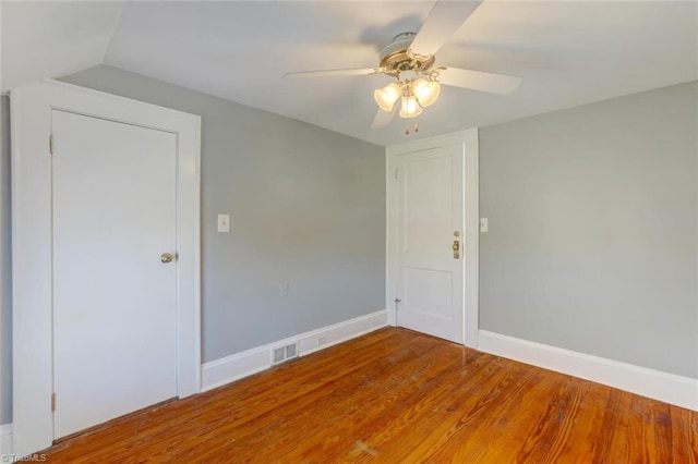 spare room featuring ceiling fan and hardwood / wood-style floors