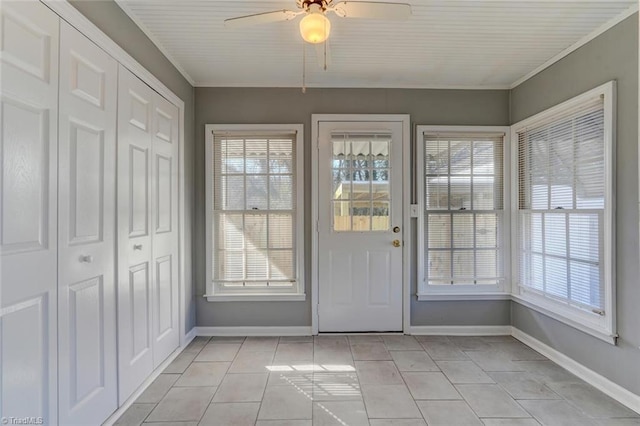 doorway to outside with light tile patterned floors, a wealth of natural light, and ceiling fan