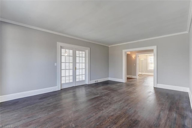 spare room with crown molding and dark wood-type flooring