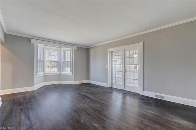 empty room with wood-type flooring, ornamental molding, and french doors