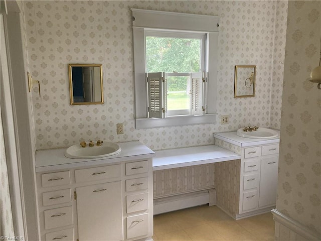 bathroom with vanity, a baseboard heating unit, and tile patterned floors