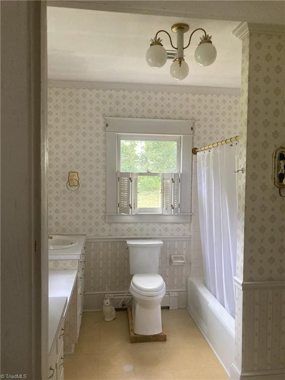 full bathroom with vanity, shower / bath combo, and toilet