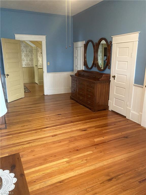 interior space featuring hardwood / wood-style flooring and lofted ceiling