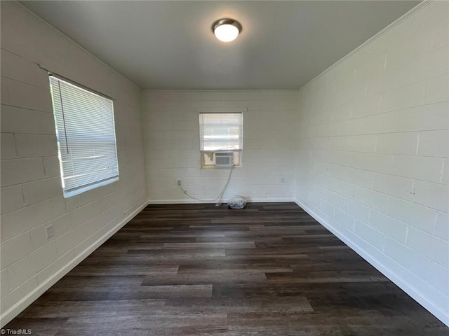 empty room with dark wood-type flooring and cooling unit