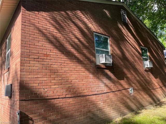 view of property exterior with brick siding
