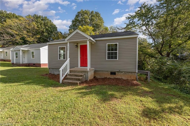 view of front of home with a front lawn