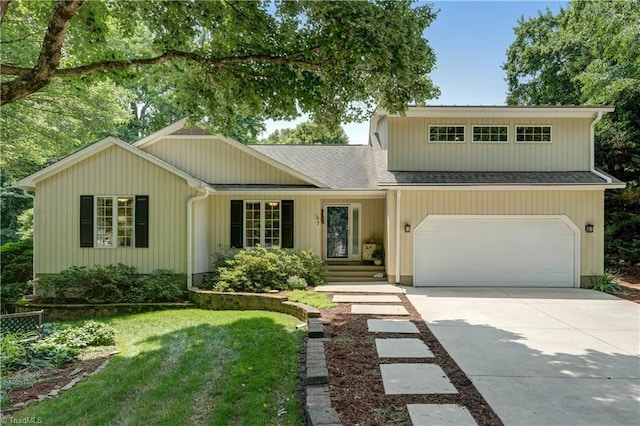 7 Pineburr Ct, Greensboro, NC 27455 - view of front of house with driveway, an attached garage, and a shingled roof