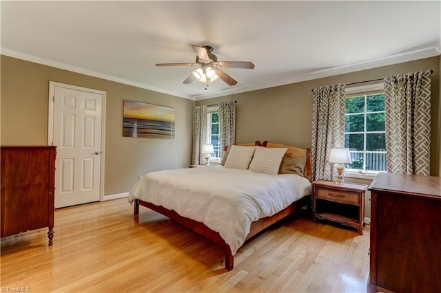 7 Pineburr Ct, Greensboro, NC 27455 - bedroom with multiple windows, light wood-style floors, crown molding, a ceiling fan, and baseboards