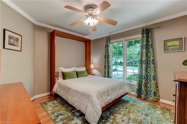 7 Pineburr Ct, Greensboro, NC 27455 - bedroom with wood finished floors, baseboards, ornamental molding, and ceiling fan