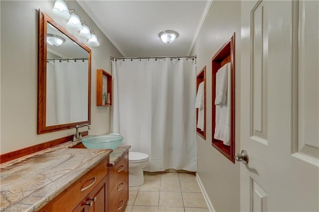 7 Pineburr Ct, Greensboro, NC 27455 - bathroom with vanity, crown molding, toilet, tile patterned floors, and baseboards